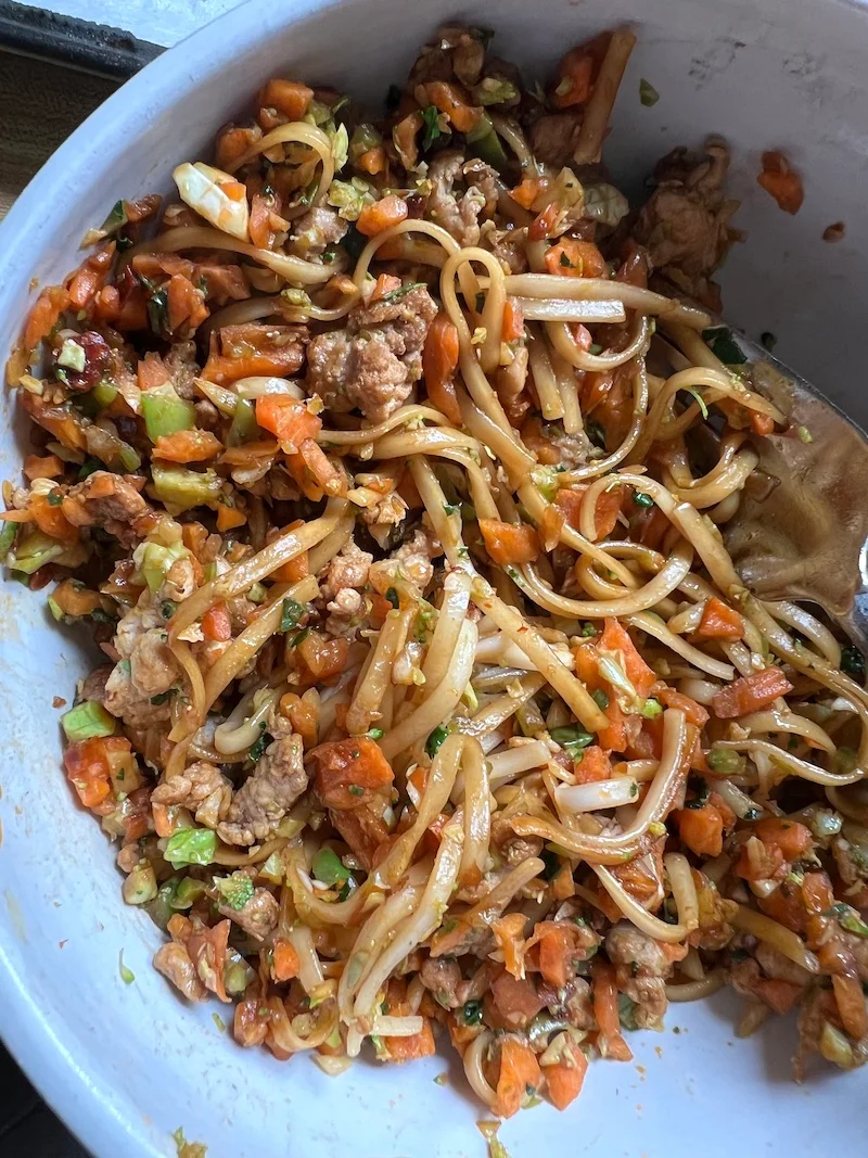 this is a plate of pork dandan noodles