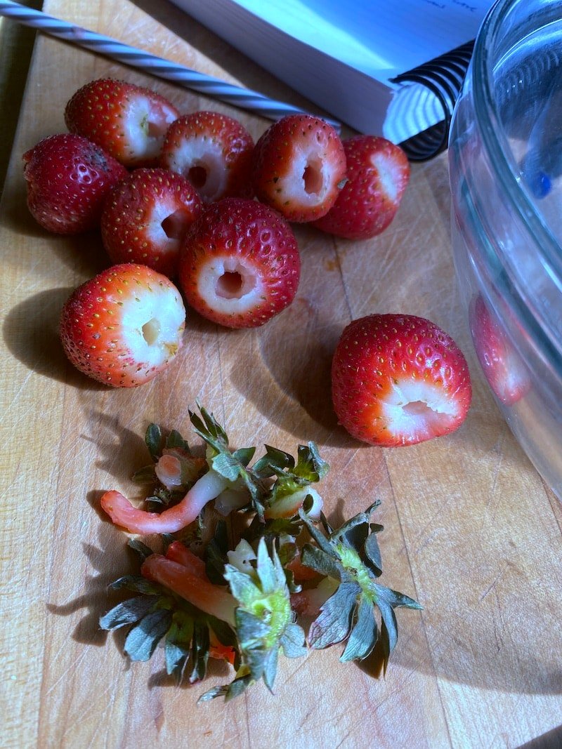 This photo shows how there is hardly any waste of the strawberry when using a straw to get the stem off the strawberry