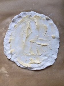 this is a picture of butter spread over pizza dough