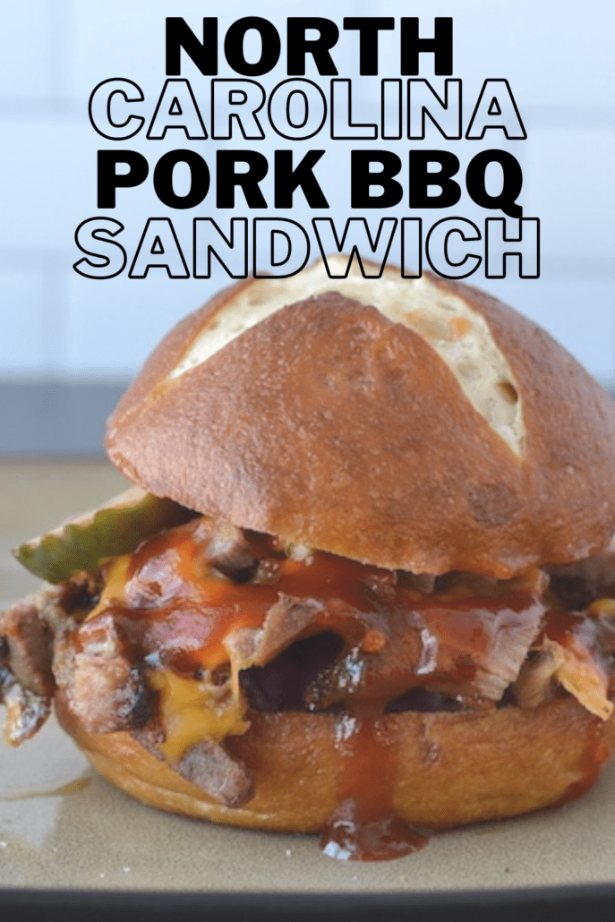 Drop the mic on this North Carolina Pork BBQ sandwich. It ticks all the boxes for me: juicy pork, with crispy bits, cheddar cheese, crisp red cabbage, pickles. The star of the show is Butcher Box's pork shoulder. Slow cooked in the oven, then pan fried with cheddar cheese right before serving on a pretzel bun and my homemade North Carolina BBQ sauce. Perfect for your next game day or family get together! On all WW plans, this sandwich is 12 points and worth every one. #bbq #pork #sandwich