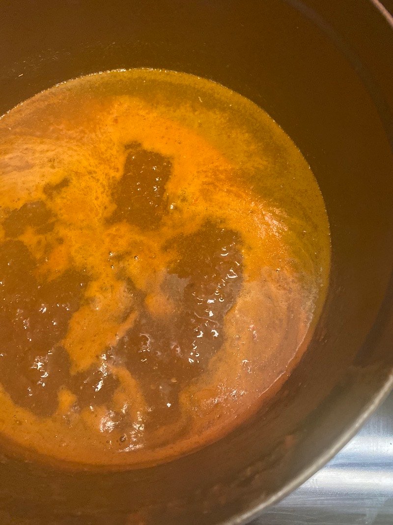 this is a pot of hot sauce simmering on a stove