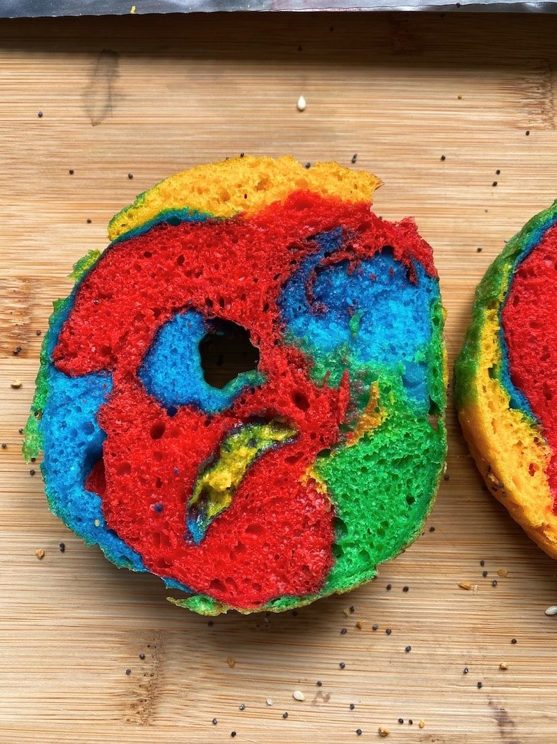 this is a picture of a cut rainbow bagel