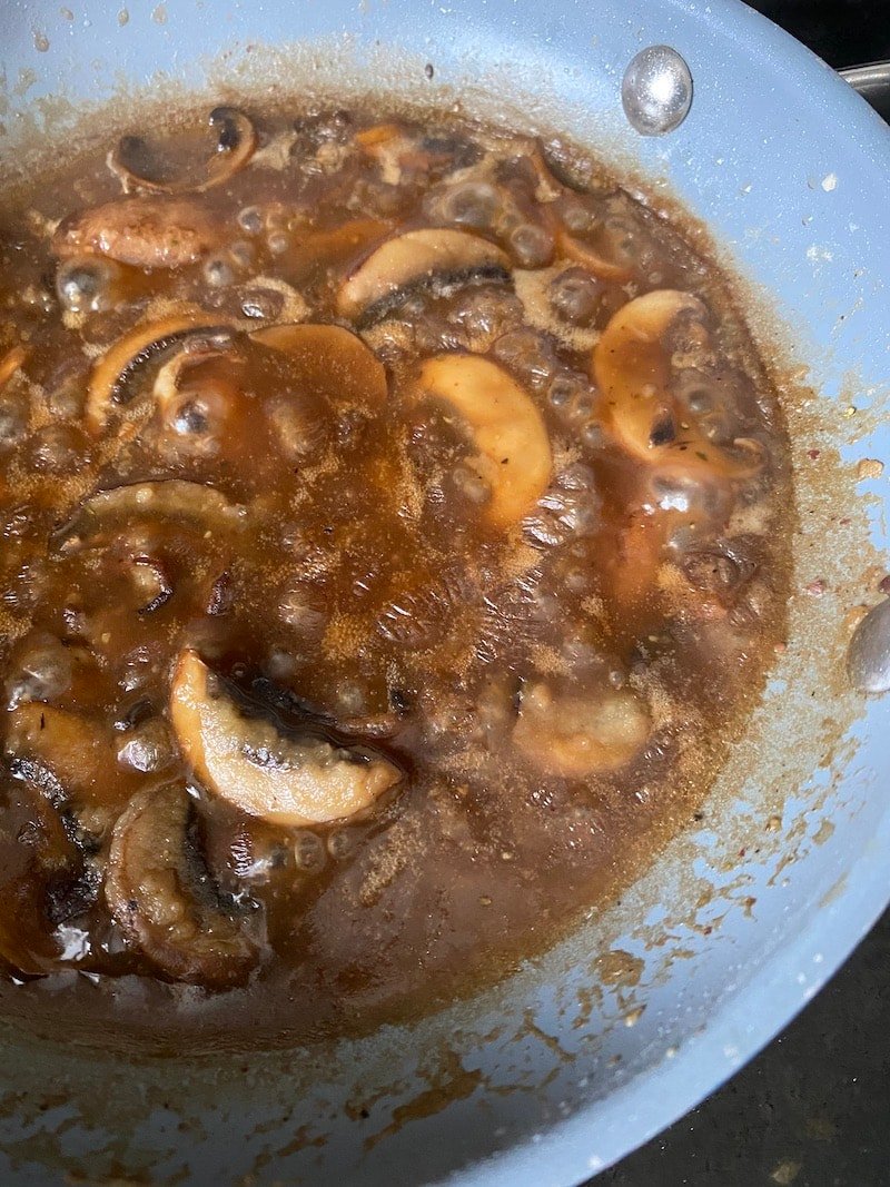 this is a skillet of brown mushroom gravy
