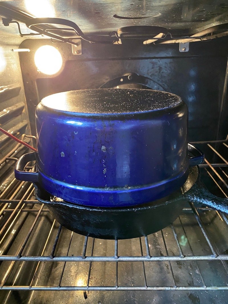 cast iron skillet in a stove to make pork bbq
