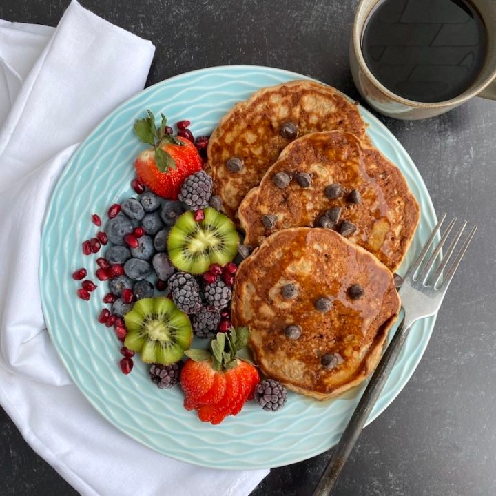 this is a photo of pancakes and fruit for breakfast