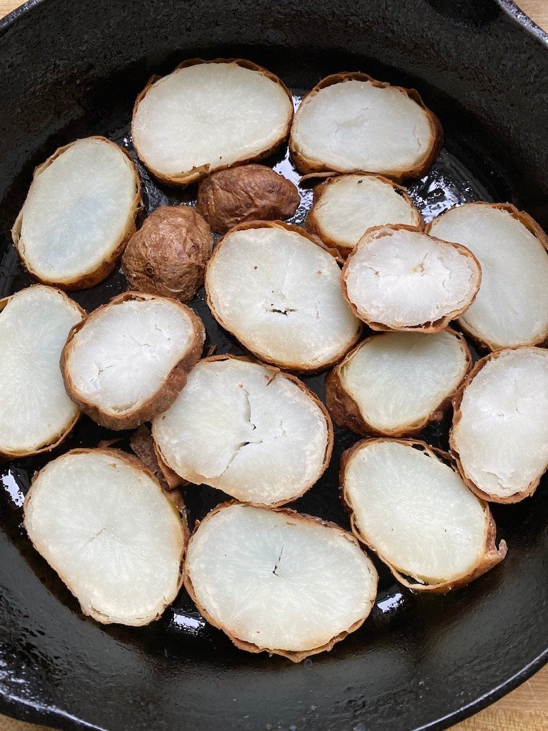 this is a picture of sliced potatoes in a skillet