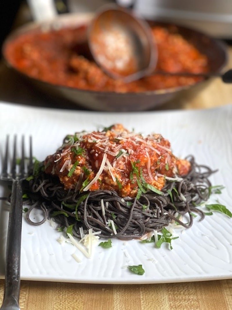 this is a photo of black bean pasta with pork ragu