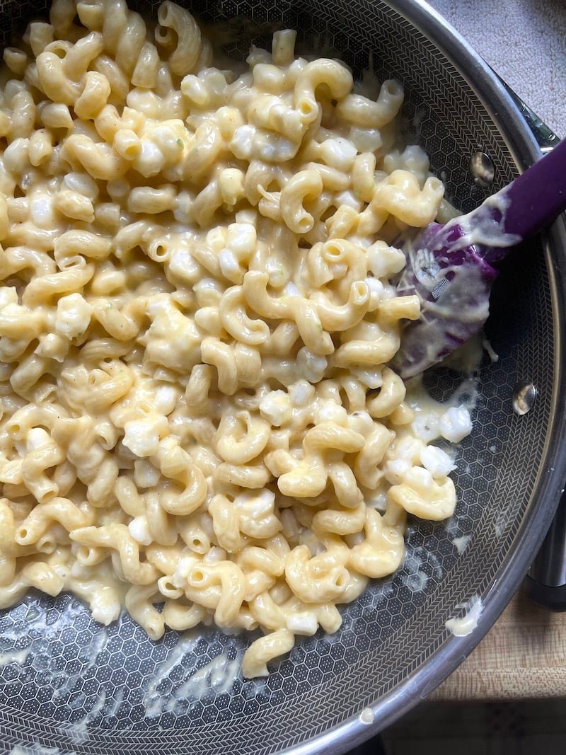 this is a photo of hominy macaroni and cheese in a skillet