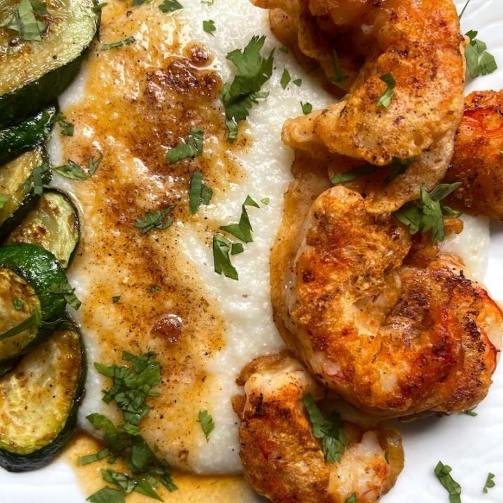 this is a photo of nashville hot shrimp with grits and zucchini