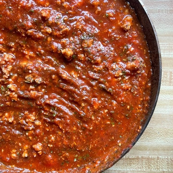 This is a photo of pork ragu simmering in a skillet