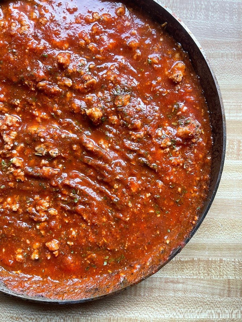 This is a photo of pork ragu simmering in a skillet