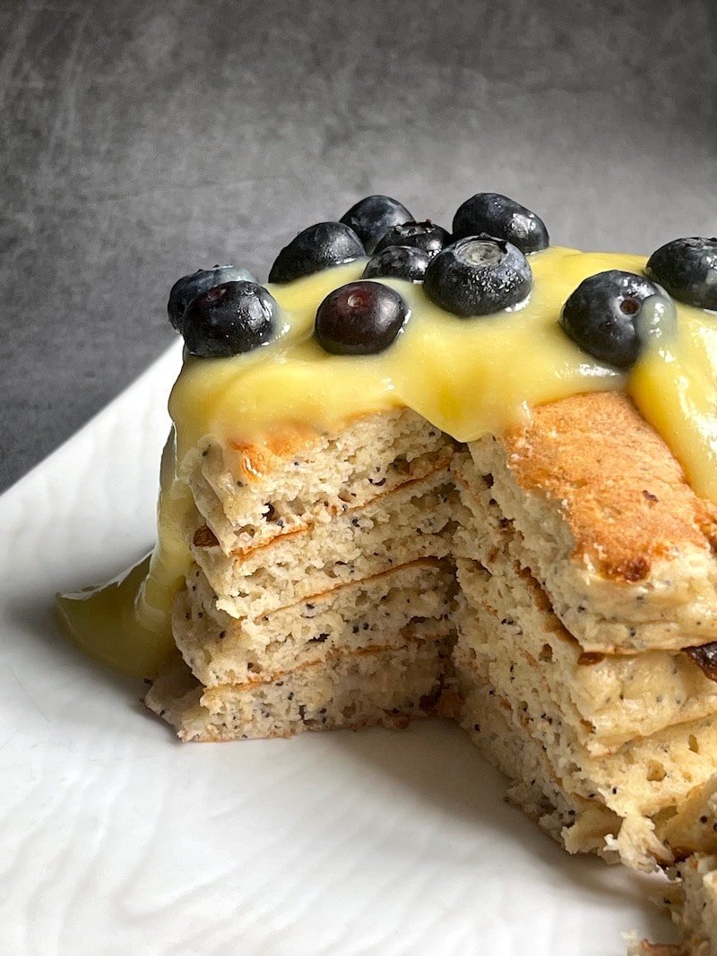 this is a photo of poppy seed pancakes with lemon curd