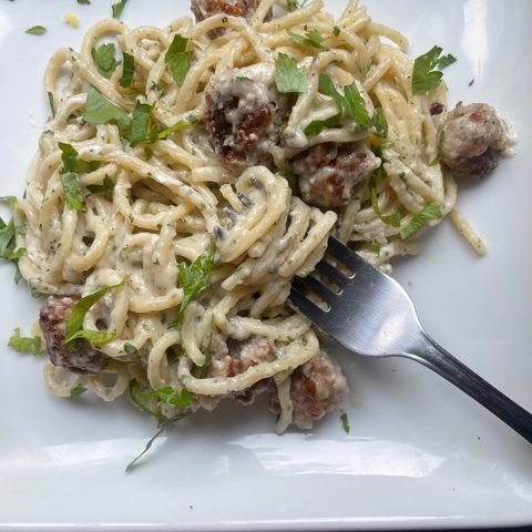 this is a photo of goat cheese pasta with mini meatballs
