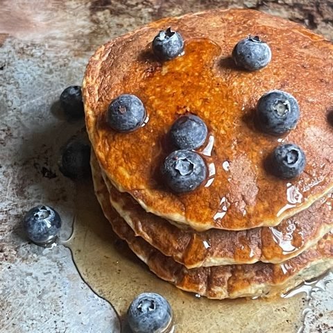 this is a photo of blueberry oat pancakes