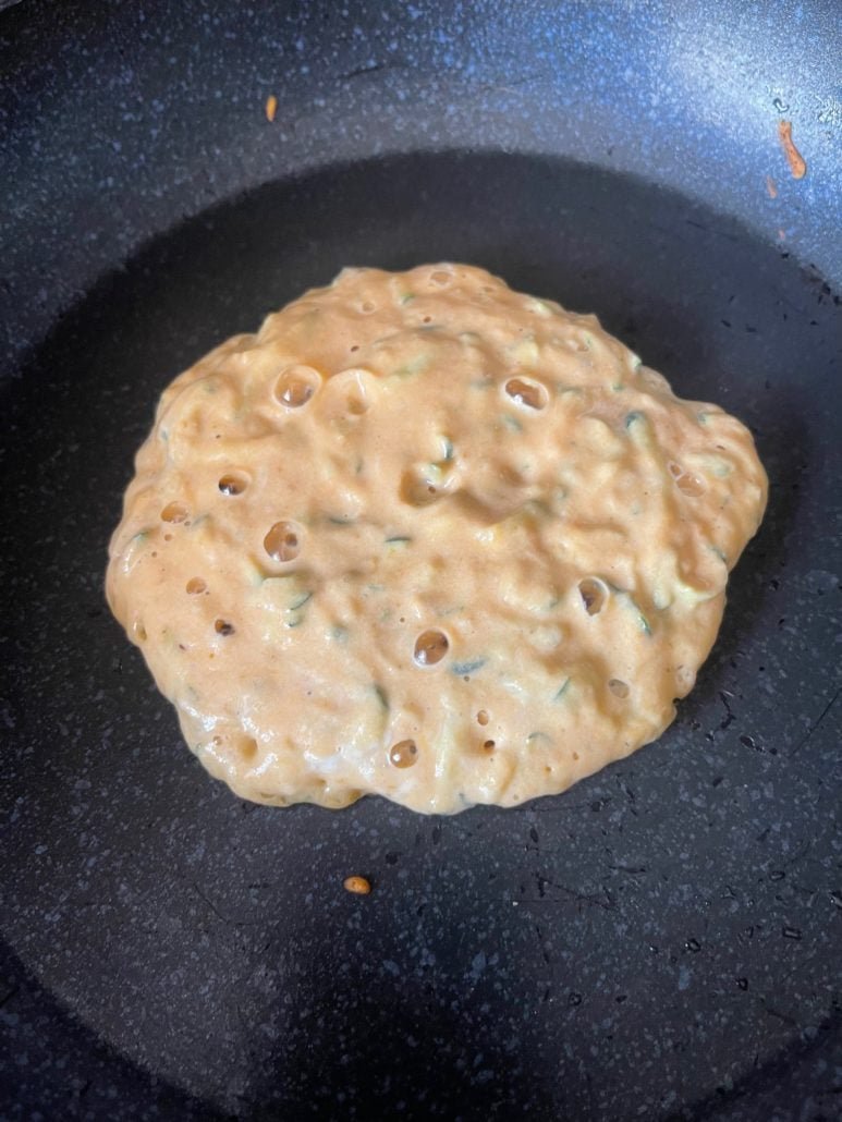this is a photo of a pancake that is ready to flip