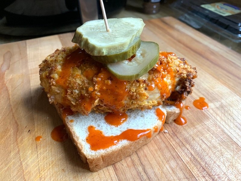 this is a piece of nashville hot chicken on white bread