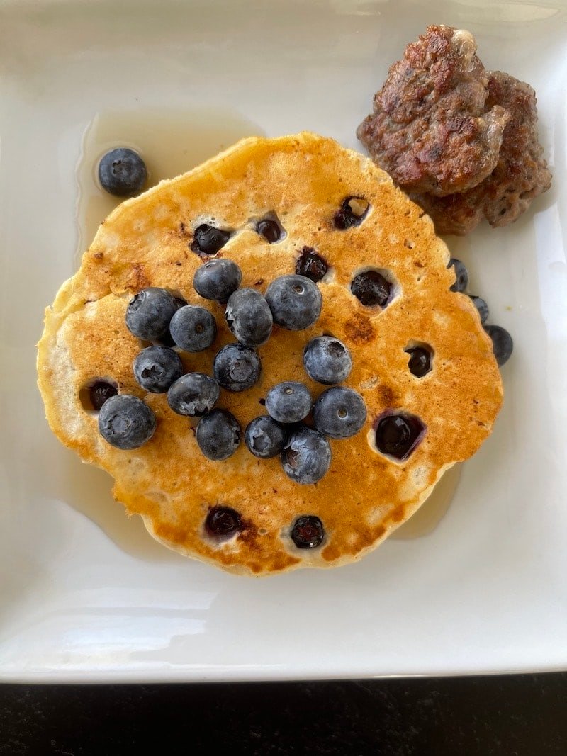 this is a photo of oat pancakes with blueberries