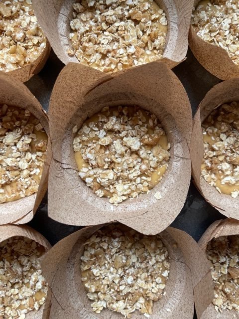 this is a picture of banana pumpkin muffins topped with granola crumble ready to bake