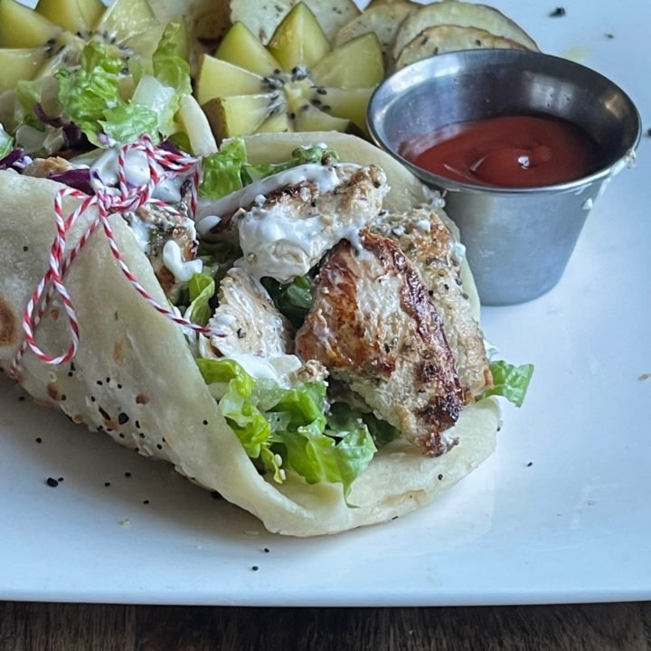 This is a photo of chicken souvlaki in a pita