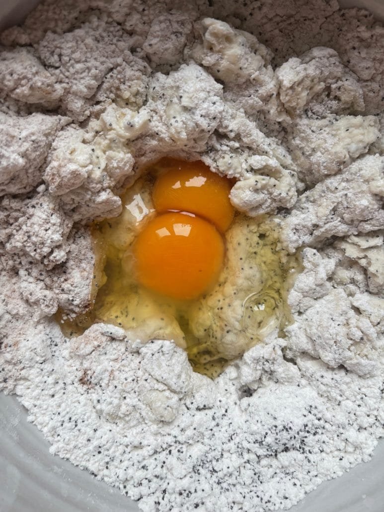 adding eggs into pancake batter