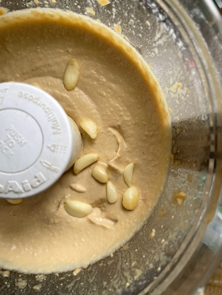 this is garlic hummus in a food processor