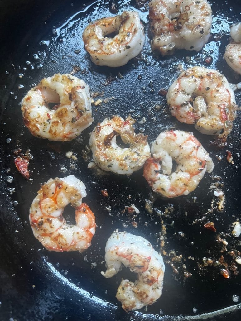 this is a photo of shrimp cooked in a cast iron skillet