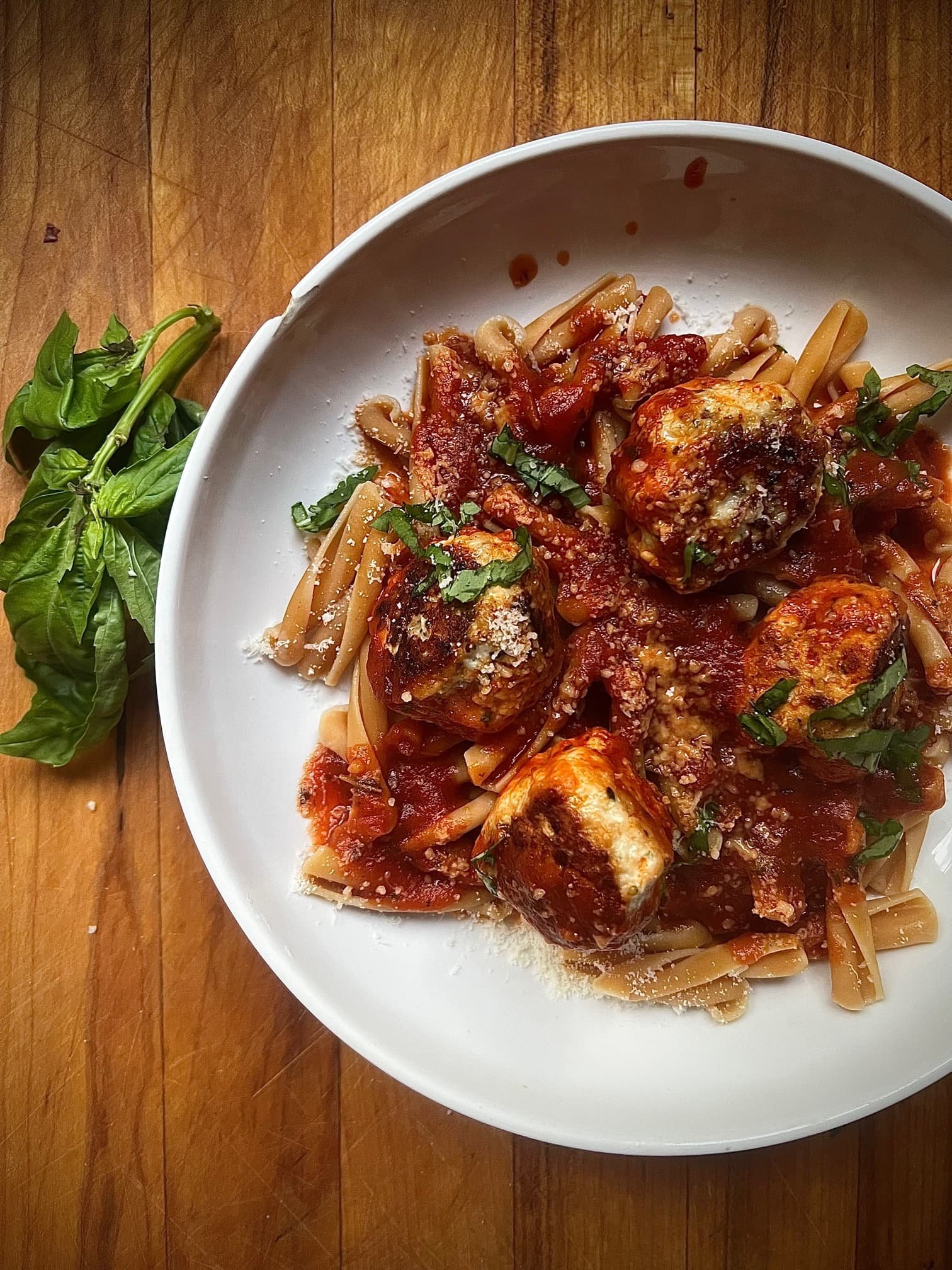 this is a bowl of pasta with turkey meatballs