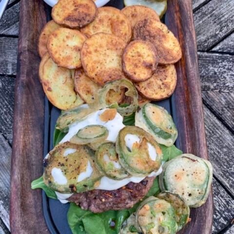 this is a plate of jalapeno popper burger