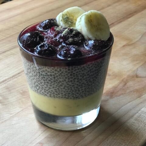 this is a glass of chia pudding with lemon curd