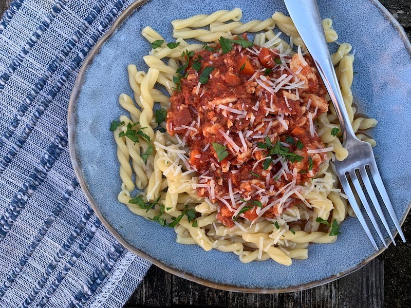 this is a bowl of pasta with turkey bolognese