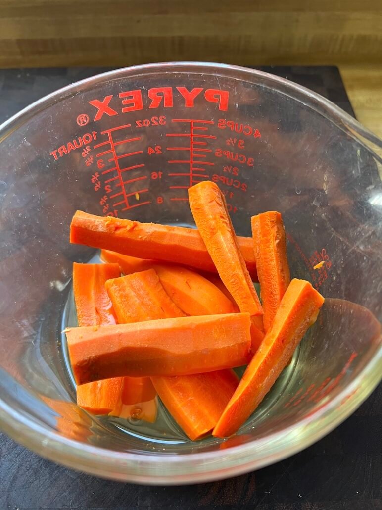 this is a bowl of cooked carrots