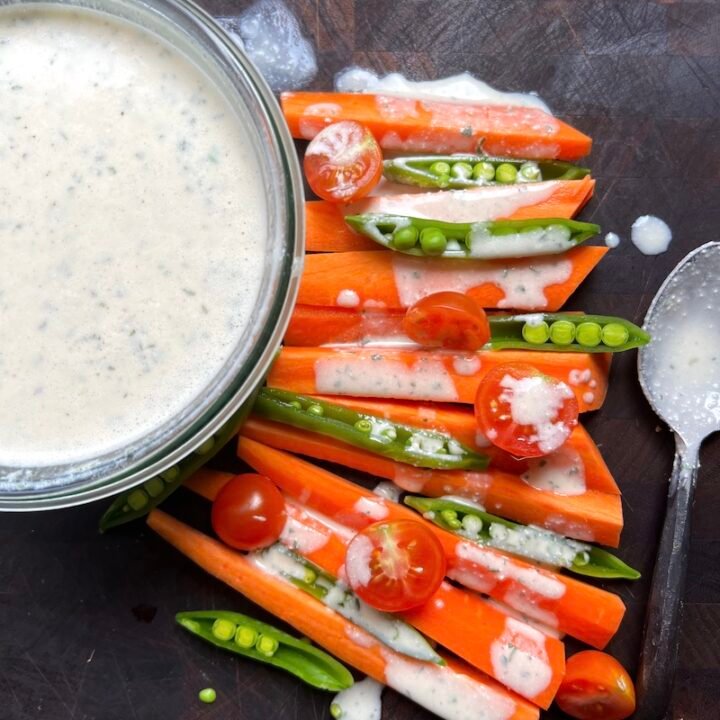 this is a jar of cottage cheese dressing with fresh vegetables
