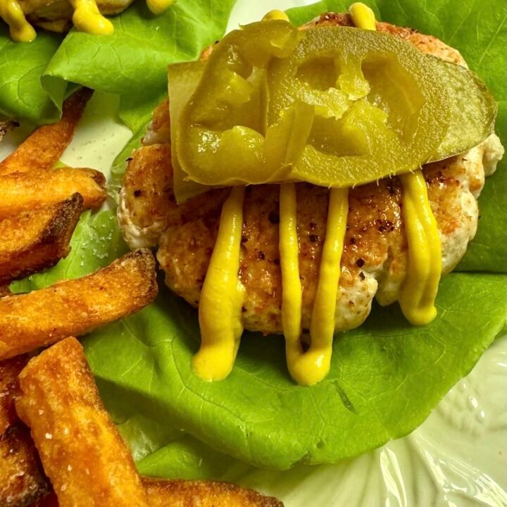 this is a juicy turkey burger in a lettuce wrap