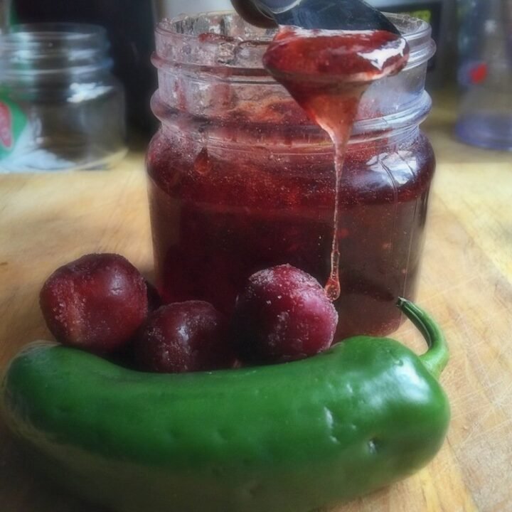 this is a jar of dark cherry jalapeno jelly