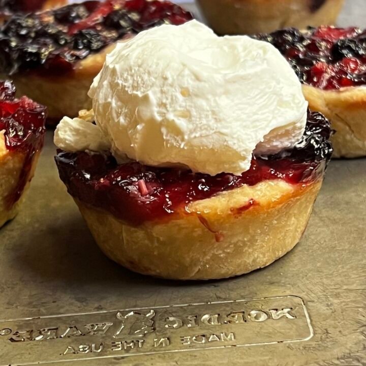 mini blueberry pie with whipped cream