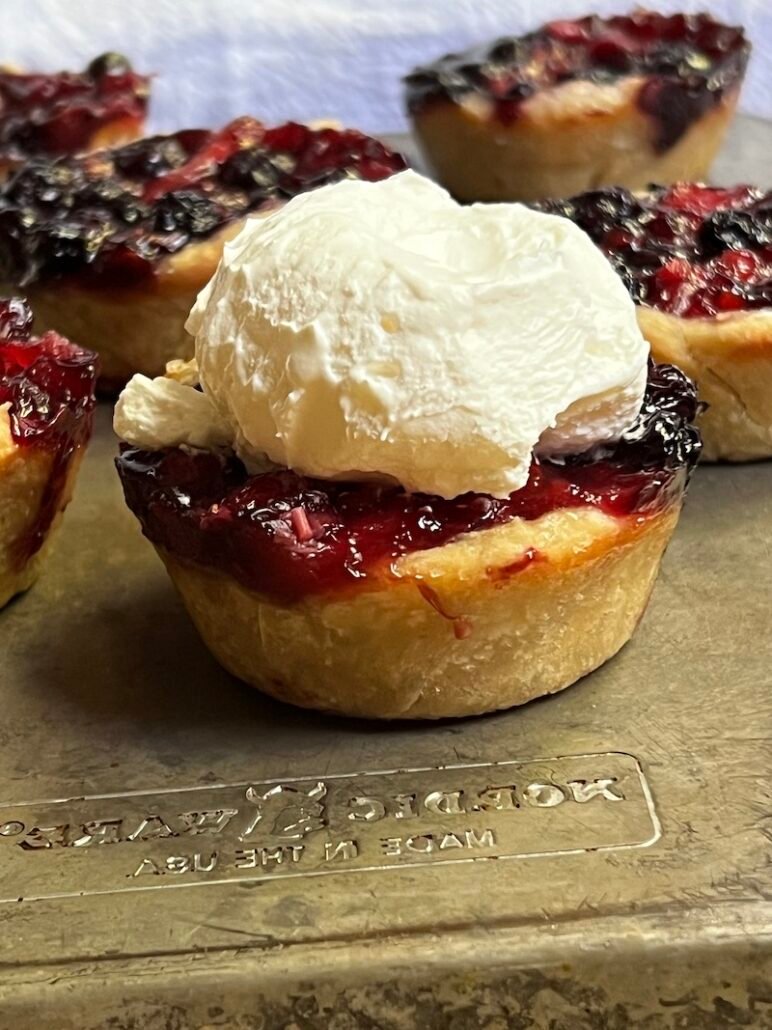 mini blueberry pie with whipped cream