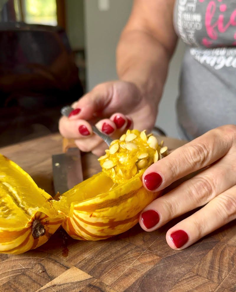 this is a zero Weight watchers points delicata squash sliced and removing seeds