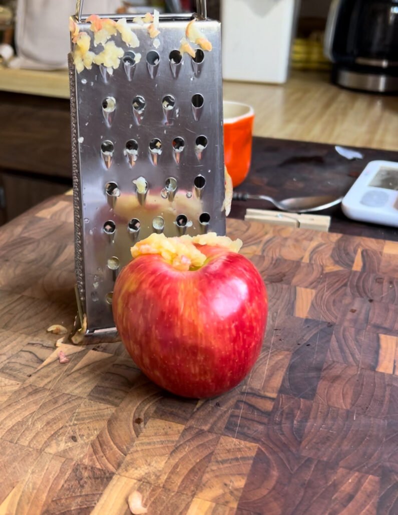 this is an apple being grated for Weight Watchers friendly apple donuts