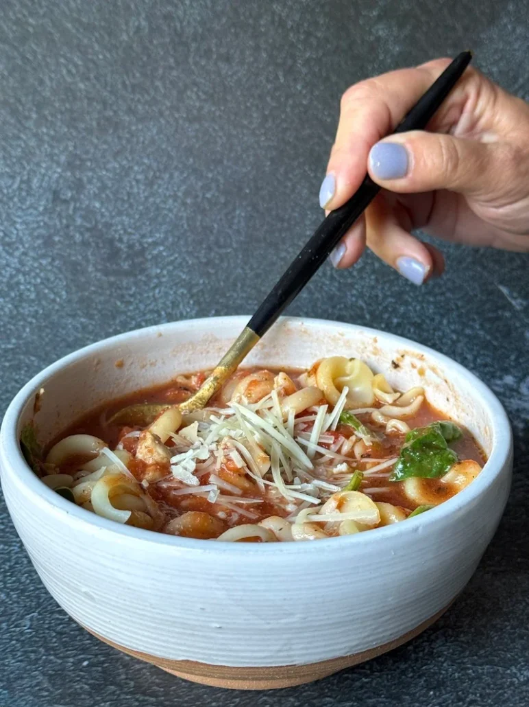 this is a bowl of lasagna soup with chicken sausage