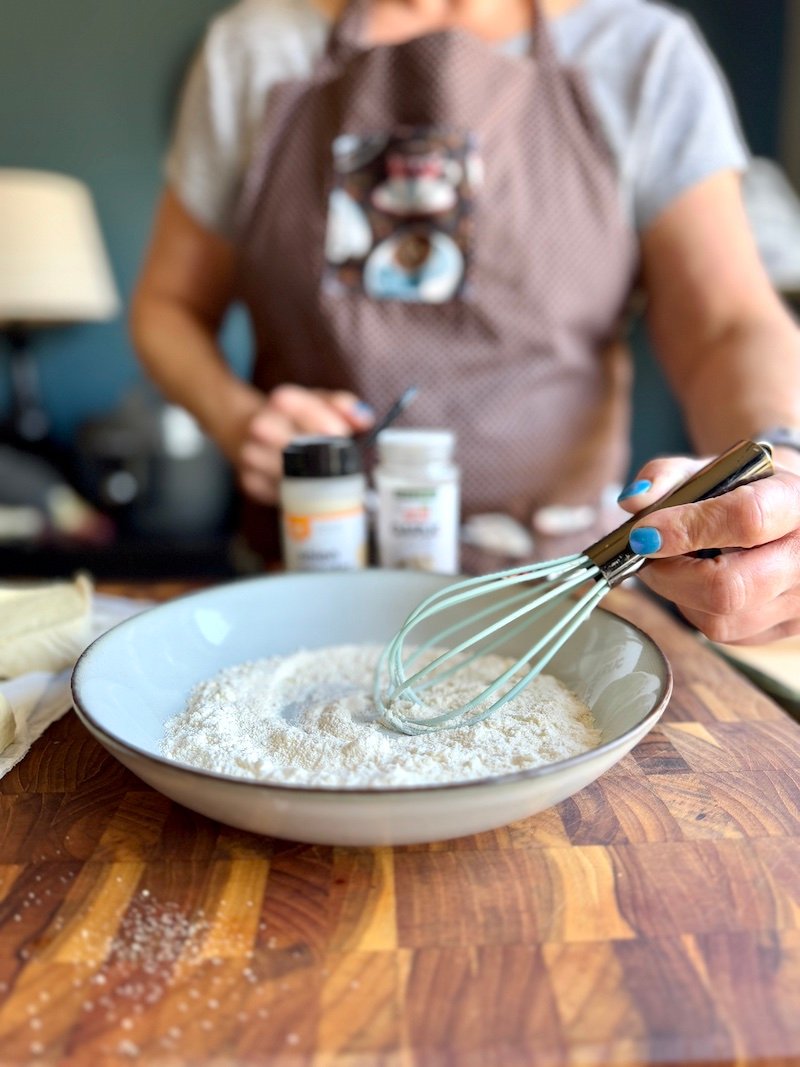 sifting flour for tofu katsu