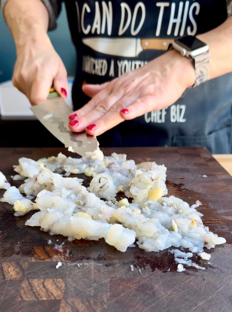 mincing shrimp and garlic for shrimp wontons