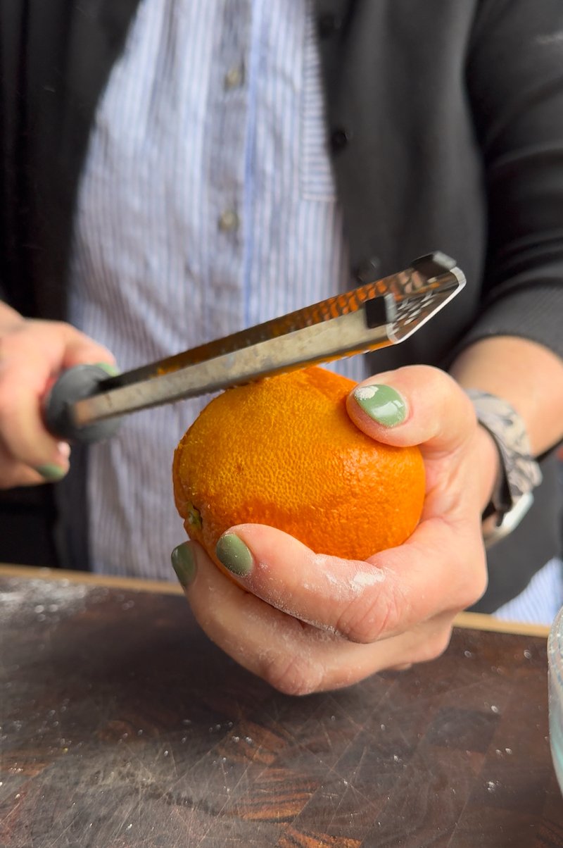 zesting orange for creamsicle cupcakes