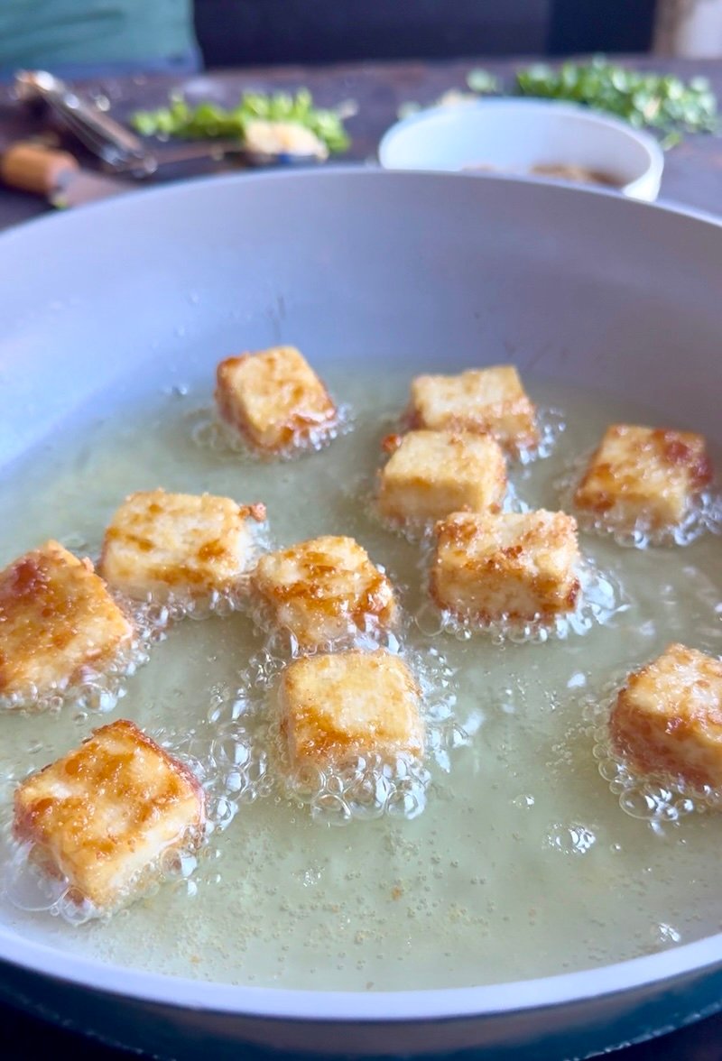 tofu frying in oil