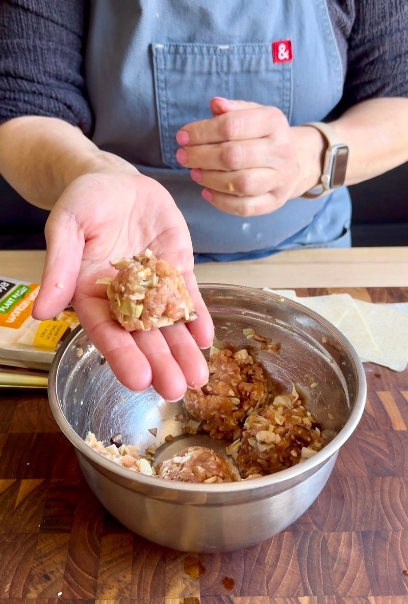 shaping pork into meatballs for lazy pork wontons
