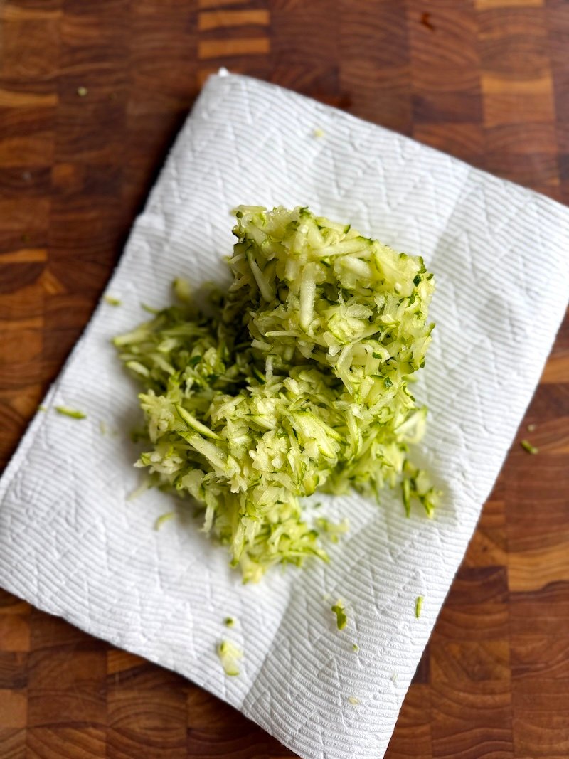 shredded zucchini on paper towels